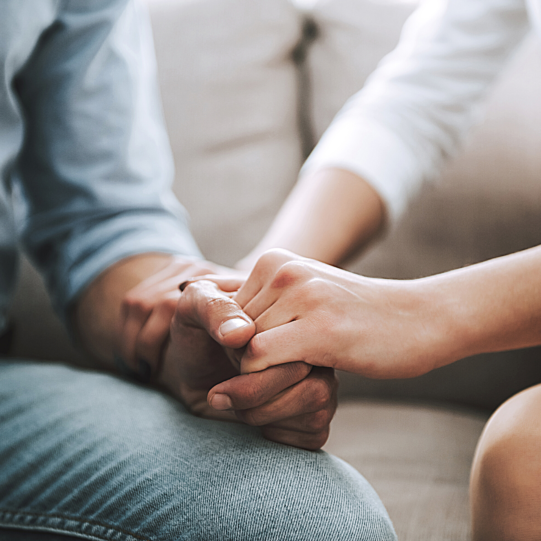 man and woman holding hands